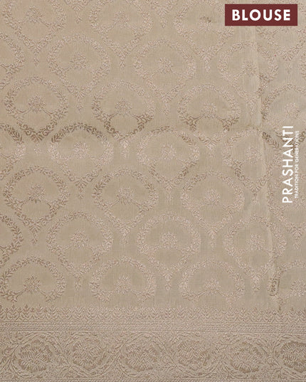 Dola silk saree cream with plain body and zari woven border