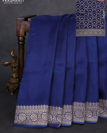 Dola silk saree peacock blue with plain body and zari woven border