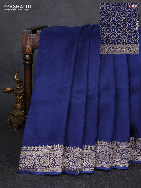 Dola silk saree peacock blue with plain body and zari woven border