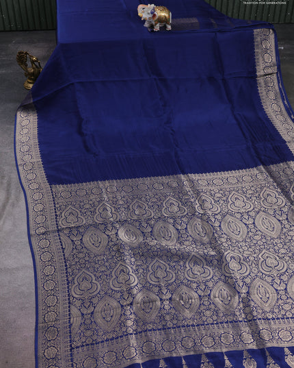 Dola silk saree peacock blue with plain body and zari woven border