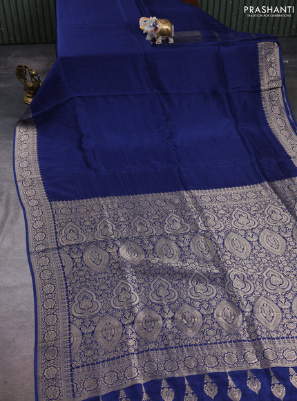 Dola silk saree peacock blue with plain body and zari woven border