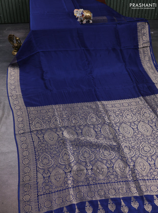 Dola silk saree peacock blue with plain body and zari woven border
