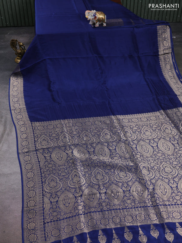 Dola silk saree peacock blue with plain body and zari woven border
