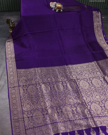 Dola silk saree purple with plain body and zari woven border