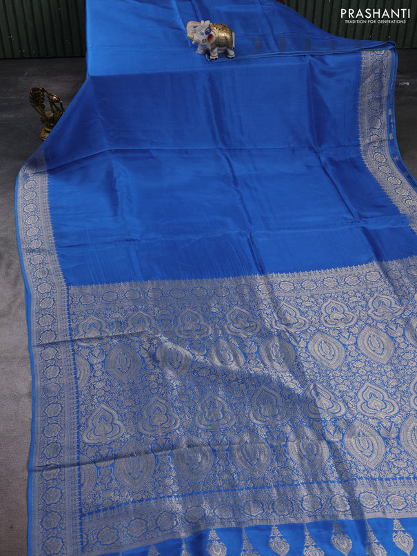 Dola silk saree blue with plain body and zari woven border