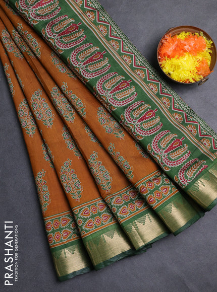 Semi maheshwari cotton saree dark mustard and green with allover floral prints and zari woven border