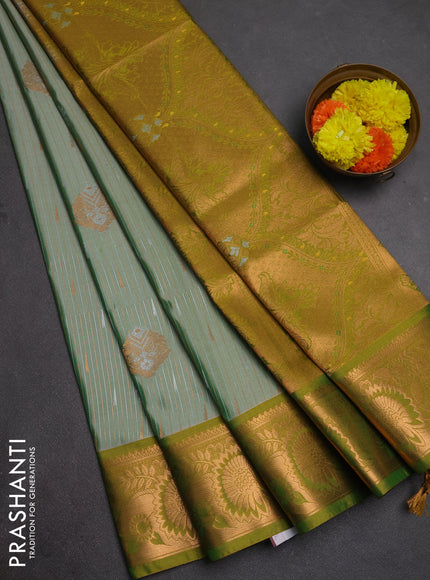 Semi soft silk saree pastel green and light green with allover silver & gold zari weaves & buttas and zari woven border
