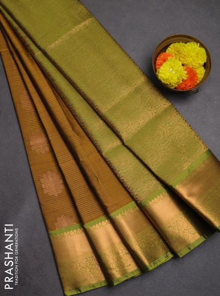 Semi soft silk saree dark mustard and green with allover zari weaves & buttas and rich zari woven border