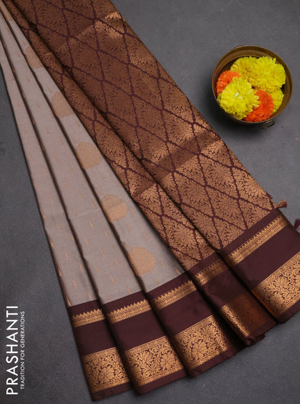 Semi soft silk saree grey and coffee brown with allover zari woven buttas and rettapet zari woven border