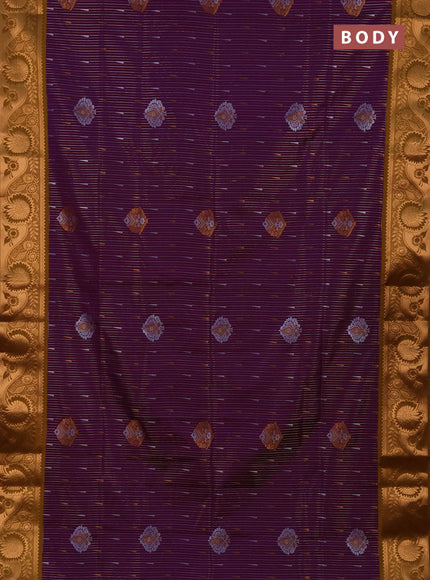 Semi soft silk saree deep purple and dark mustard with allover silver & gold zari weaves & buttas and zari woven border