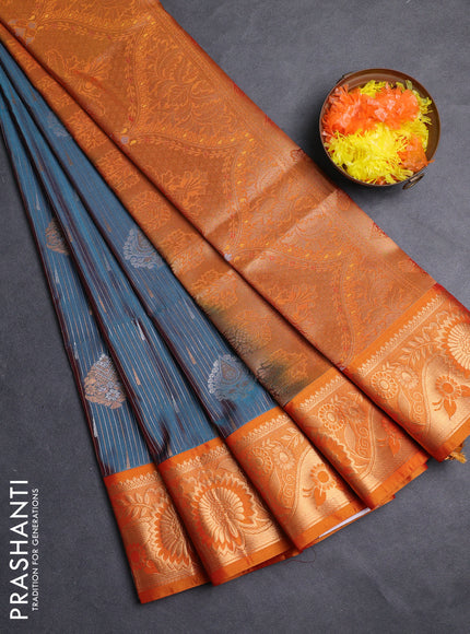 Semi soft silk saree peacock green and rustic orange with allover silver & gold zari weaves & buttas and zari woven border