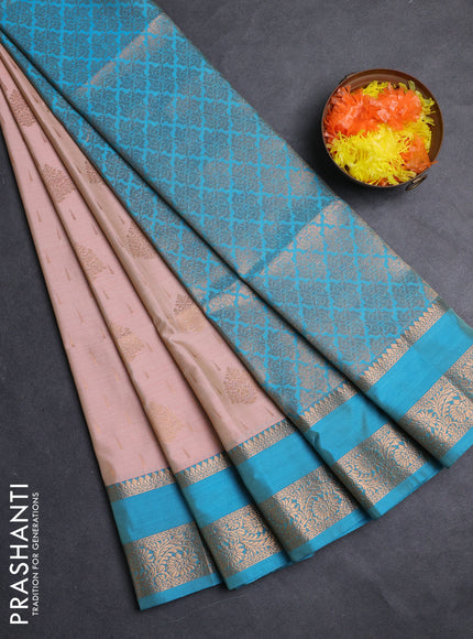 Semi soft silk saree peach shade and cs blue with allover zari woven buttas and rettapet zari woven border