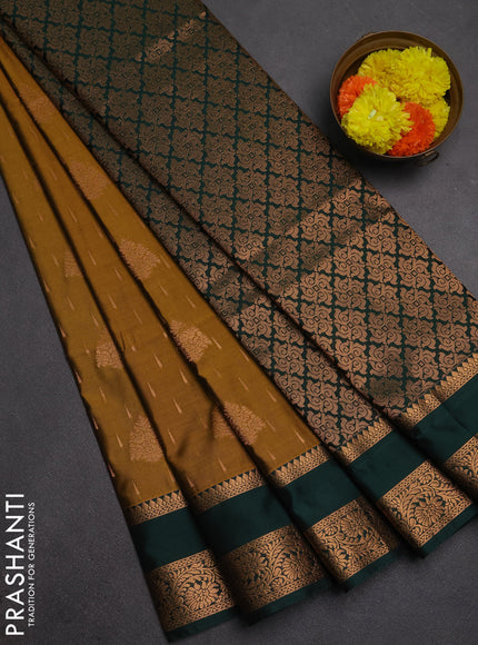 Semi soft silk saree dark mustard and bottle green with allover zari woven buttas and rettapet zari woven border