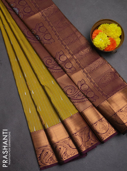 Semi soft silk saree mustard green and wine shade with allover silver & gold zari weaves & buttas and zari woven border