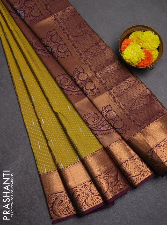 Semi soft silk saree mustard green and wine shade with allover silver & gold zari weaves & buttas and zari woven border
