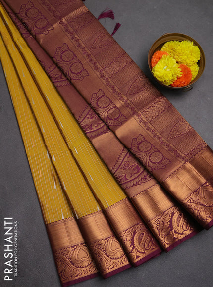 Semi soft silk saree mustard yellow and wine shade with allover silver & gold zari weaves & buttas and zari woven border