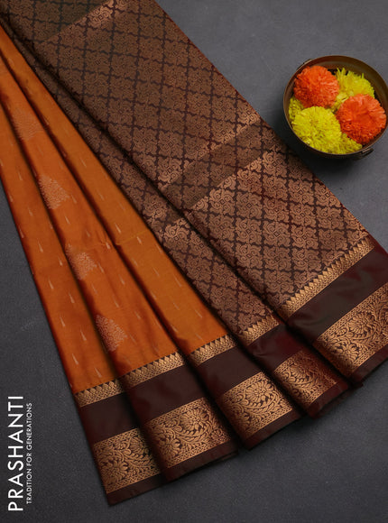 Semi soft silk saree rust shade and manthulir green with allover zari woven buttas and rettapet zari woven border