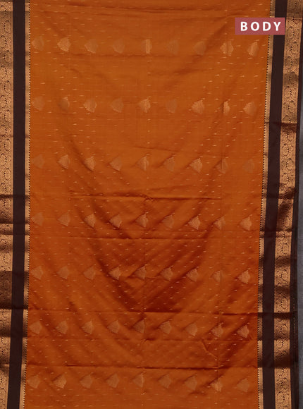 Semi soft silk saree rust shade and manthulir green with allover zari woven buttas and rettapet zari woven border