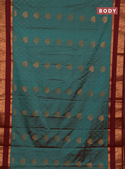 Semi soft silk saree teal green and maroon with allover zari woven buttas and rettapet zari woven border