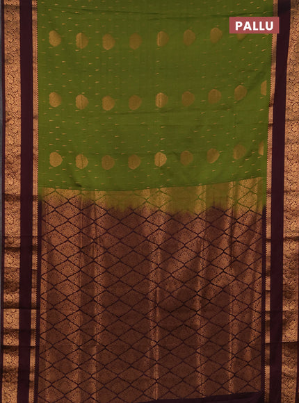 Semi soft silk saree green and deep maroon with allover zari woven buttas and rettapet zari woven border