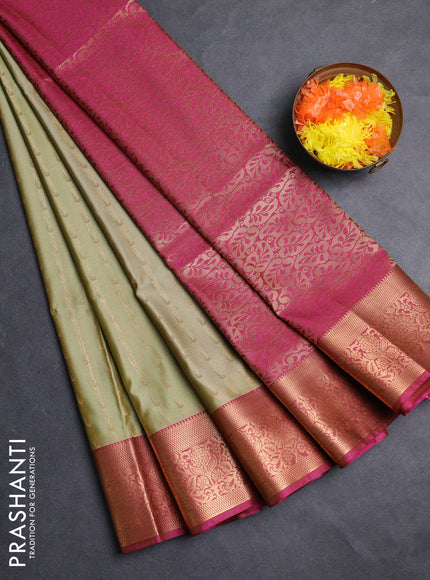 Semi soft silk saree mild pista green and pink shade with allover zari woven muniya buttas and zari woven border