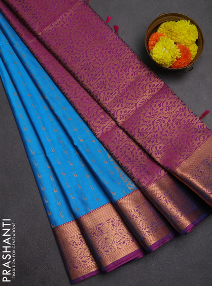 Semi soft silk saree cs blue and magenta pink with allover zari woven muniya buttas and zari woven border