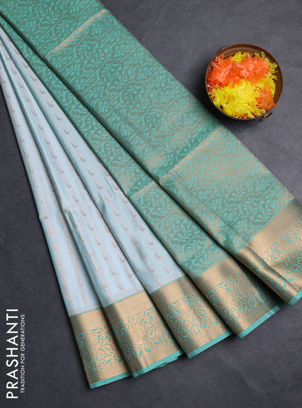 Semi soft silk saree teal shade and teal green with allover zari woven muniya buttas and zari woven border
