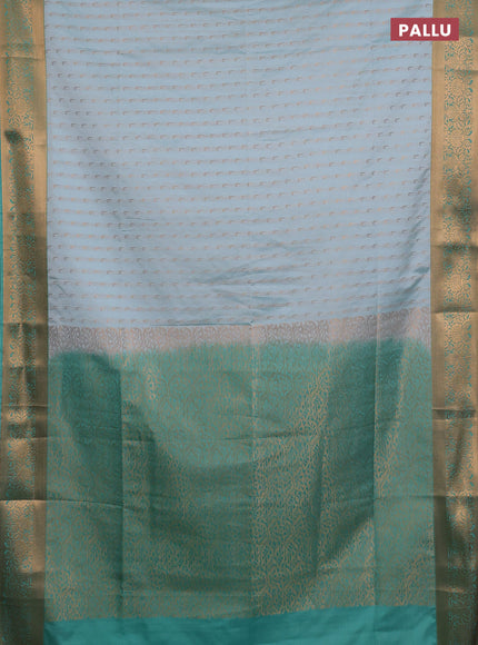 Semi soft silk saree teal shade and teal green with allover zari woven muniya buttas and zari woven border