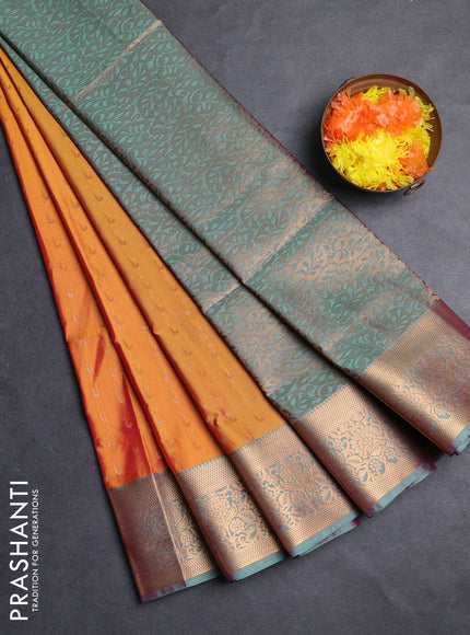 Semi soft silk saree sunset orange and teal green with allover zari woven muniya buttas and zari woven border