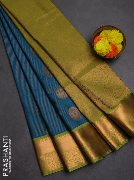 Semi soft silk saree peacock green and green with allover zari weaves & buttas and rich zari woven border