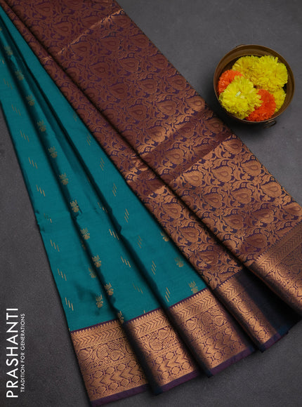 Semi soft silk saree teal green and wine shade with allover zari woven buttas and zari woven border