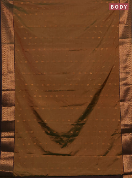 Semi soft silk saree dual shade of mustard green and bottle green with allover zari woven buttas and zari woven border