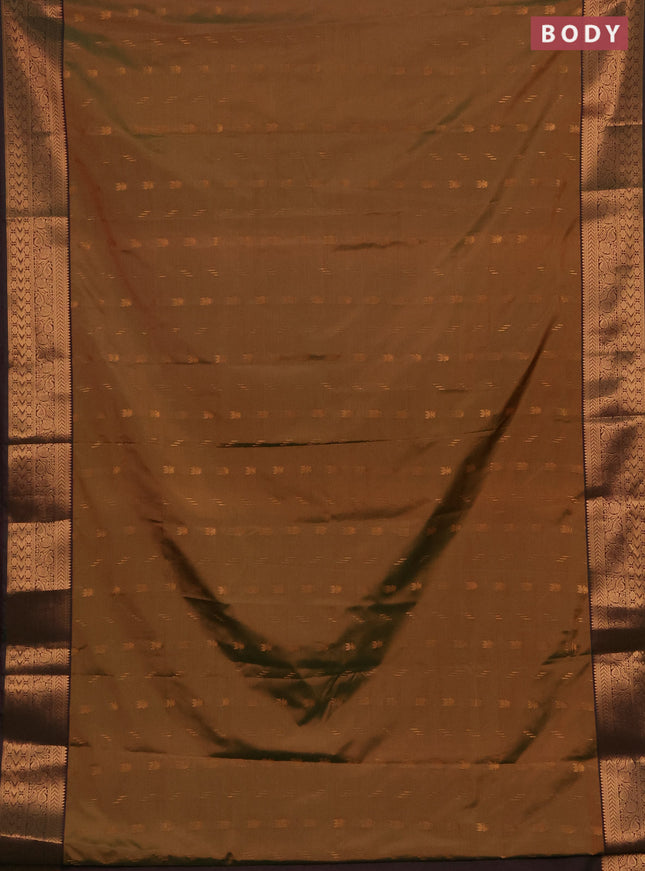 Semi soft silk saree dual shade of mustard green and bottle green with allover zari woven buttas and zari woven border