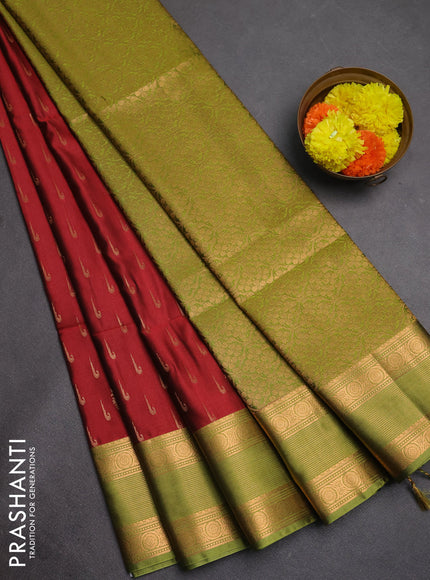 Semi soft silk saree maroon shade and green with allover zari woven buttas and zari woven border
