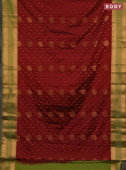 Semi soft silk saree maroon shade and green with allover zari woven buttas and zari woven border