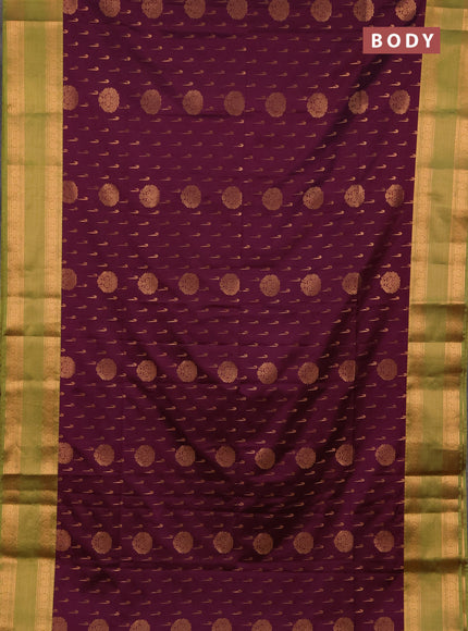 Semi soft silk saree wine shade and green with allover zari woven buttas and zari woven border