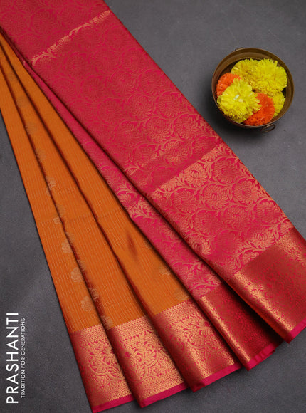 Semi soft silk saree rustic orange and pink with allover zari weaves & buttas and zari wovne border