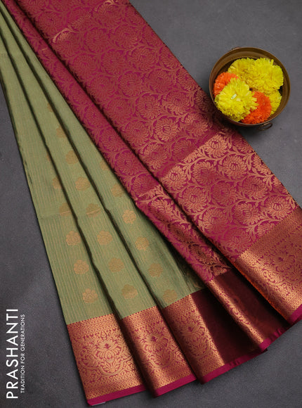 Semi soft silk saree elaichi green and magenta pink with allover zari weaves & buttas and zari wovne border
