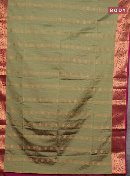 Semi soft silk saree elaichi green and magenta pink with allover zari weaves & buttas and zari wovne border