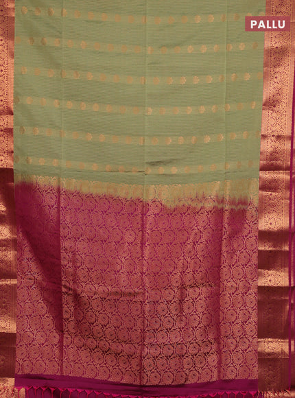 Semi soft silk saree elaichi green and magenta pink with allover zari weaves & buttas and zari wovne border