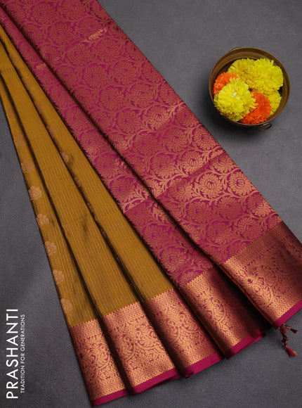 Semi soft silk saree mustard green and magenta pink with allover zari weaves & buttas and zari wovne border