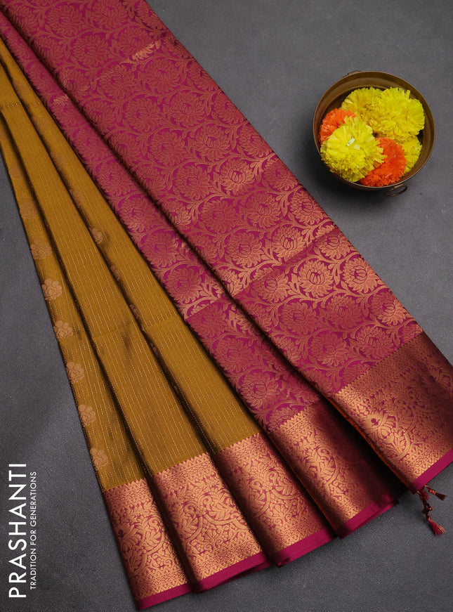 Semi soft silk saree mustard green and magenta pink with allover zari weaves & buttas and zari wovne border