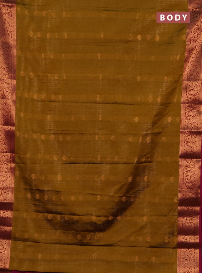 Semi soft silk saree mustard green and magenta pink with allover zari weaves & buttas and zari wovne border