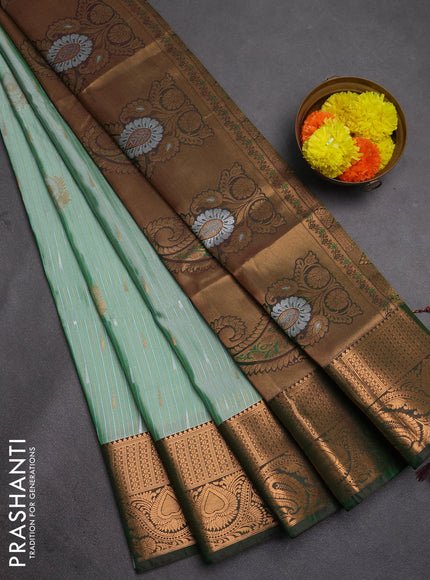 Semi soft silk saree pastel green and bottle green with allover silver & gold zari stripes & buttas and zari woven border
