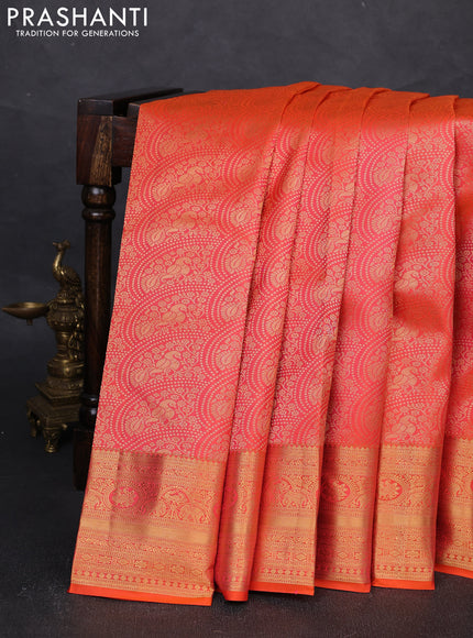 Pure kanchipuram silk saree dual shade of orange with allover zari woven brocade weaves and rich zari woven border