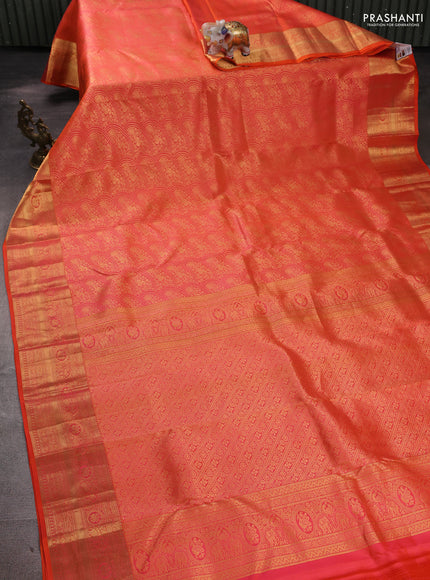 Pure kanchipuram silk saree dual shade of orange with allover zari woven brocade weaves and rich zari woven border