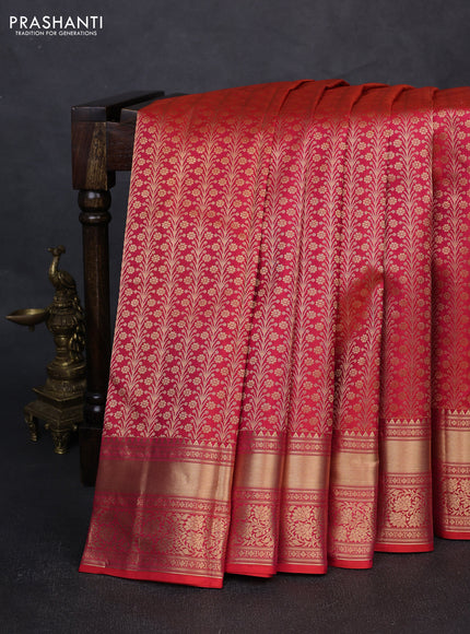 Pure kanchipuram silk saree dual shade of pinkish orange with allover zari woven brocade weaves and rich zari woven border