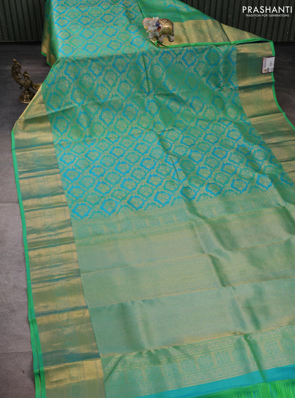 Pure kanchipuram silk saree teal bluish green with allover zari woven brocade weaves and rich zari woven border