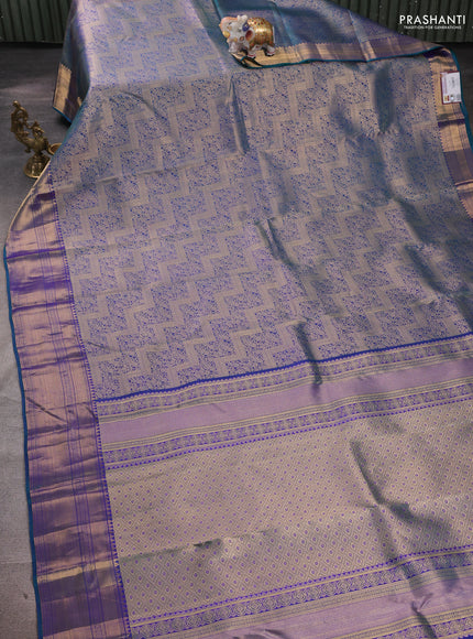 Pure kanchipuram silk saree dual shade of bluish green with allover zari woven brocade weaves and rich zari woven border