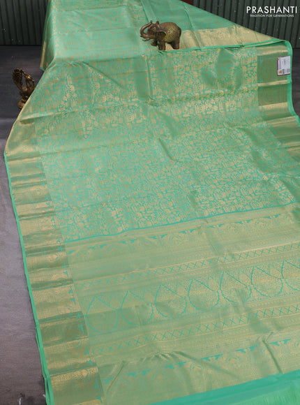 Pure kanchipuram silk saree pastel green with allover zari woven brocade weaves and rich zari woven border